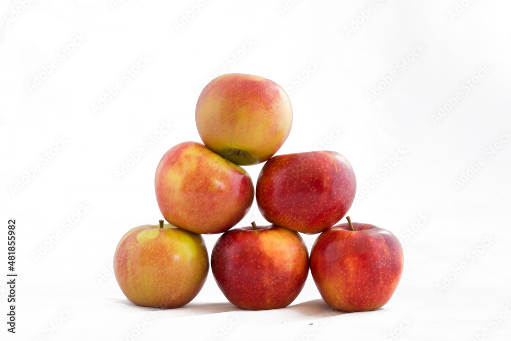 A pyramid of apples isolated on a white background A pyramid of apples isolated on a white background