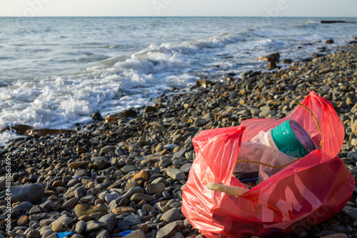 Plastic garbage on the beach. Environmental and ocean plastic pollution. Ecology and care for nature