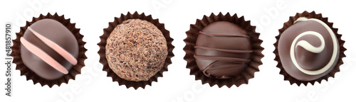 Fotografie Set with delicious sweet chocolate truffles on white background, top view