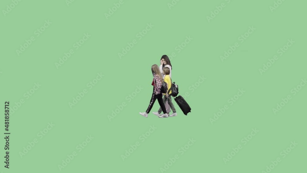 A mother with her son and daughter goes and carries a bag on wheels. Green screen video with alpha channel A mother with her son and daughter goes and carries a bag on wheels. Green screen video with alpha channel