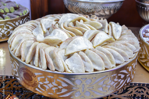 Moroccan biscuits are served with tea. Moroccan biscuits are offered at the wedding and Eid al-Fitr. Cornes de gazelles. photo