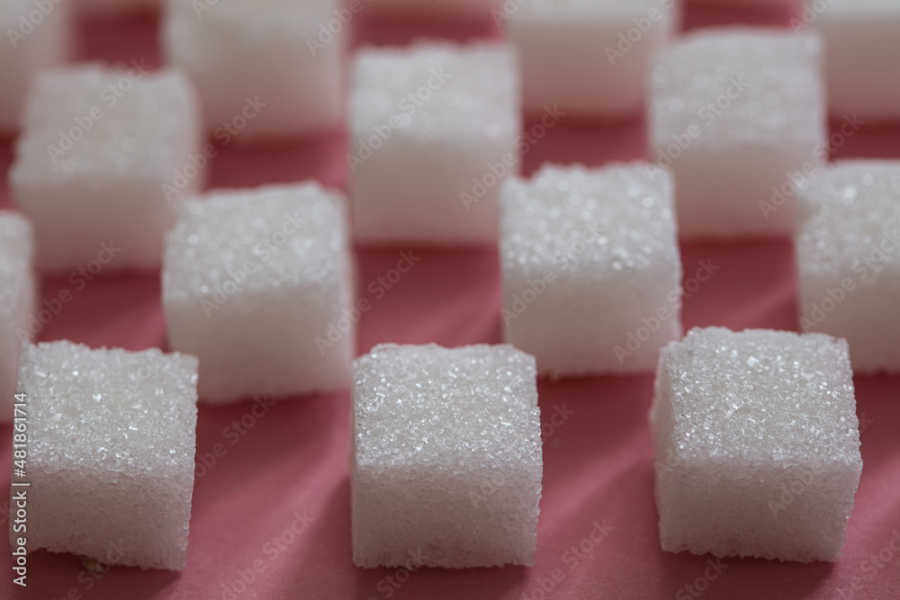 Sugar cubes on pink background Sugar cubes on pink background