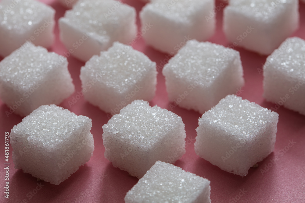 Sugar cubes on pink background Sugar cubes on pink background
