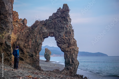 The traveler at the arch rock at Cape Giant © Pavel