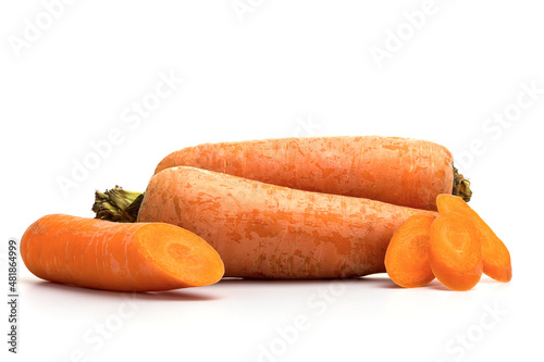 Fresh Carrot isolated on white background. Whole and sliced ripe carrots on white background. Bright, juicy, orange cut, texture. Copy space, selectiv focus photo