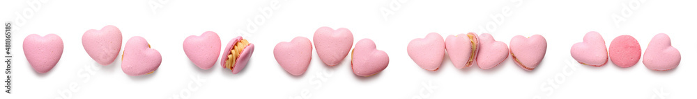 Tasty heart-shaped macaroons on white background, top view. Valentine's Day celebration