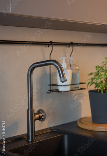 gray plumbing faucet in the interior of the kitchen