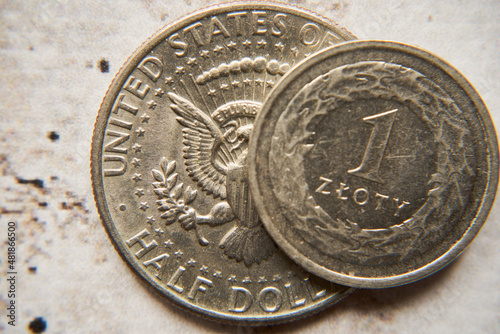 amerykański dolar i jeden złoty na betonie ,polski złoty	 photo