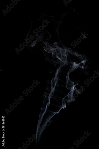 White natural steam smoke effect on solid black background with abstract blur motion wave swirl.
