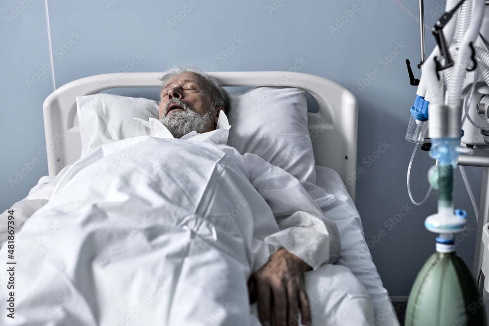 caucasian senior man patient lying on bed at hospital ward. Lonely old man sleeping in Nursing
