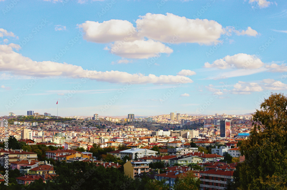 Aerial landscape view of Ankara in autumn time. Modern high-rise buildings and red tile roof old houses. Traditional housing in Ankara, the Turkish capital. Scenic cityscape view