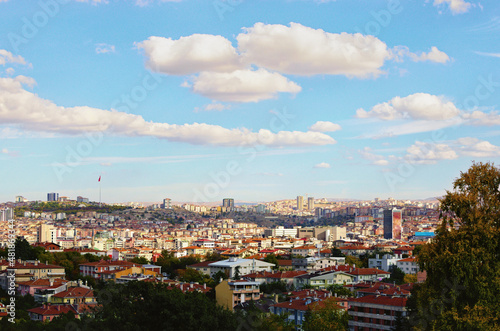 Aerial landscape view of Ankara in autumn time. Modern high-rise buildings and red tile roof old houses. Traditional housing in Ankara, the Turkish capital. Scenic cityscape view