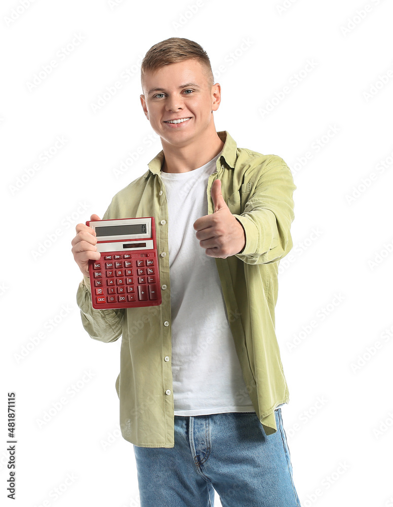Handsome young man with calculator showing thumb-up on white background Handsome young man with calculator showing thumb-up on white background
