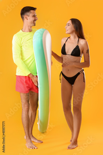 Young couple with board for...