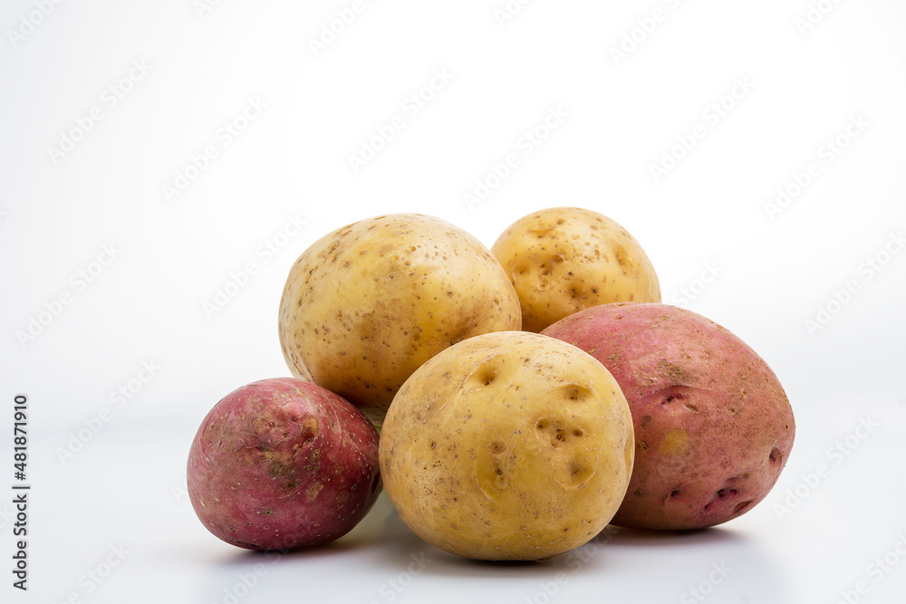 New potato isolated on white background close up. Group of two red potatoes isolated. Little potatoes, Product Image . Copy space, selective focus New potato isolated on white background close up. Group of two red potatoes isolated. Little potatoes, Product Image . Copy space, selective focus