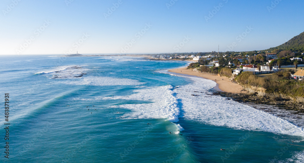 Aerial view of Atlantic waves breaking in south Spain at a winter evening. Surfer swell waves breaking elegantly