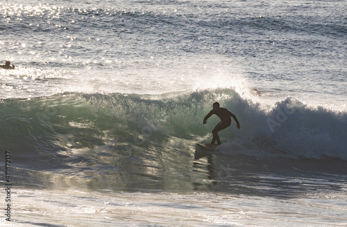 Photography Young man surfing wave in Cadiz, Andalusia