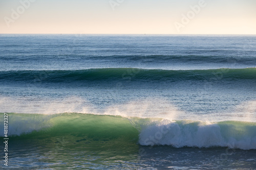 Beautiful Atlantic waves breaking in south Spain at a winter evening. Surfer swell waves breaking elegantly