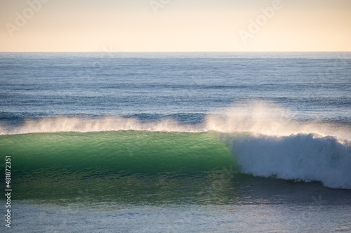Beautiful Atlantic waves breaking in south Spain at a winter evening. Surfer swell waves breaking elegantly photo