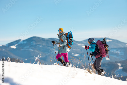 Two people in the mountains in winter