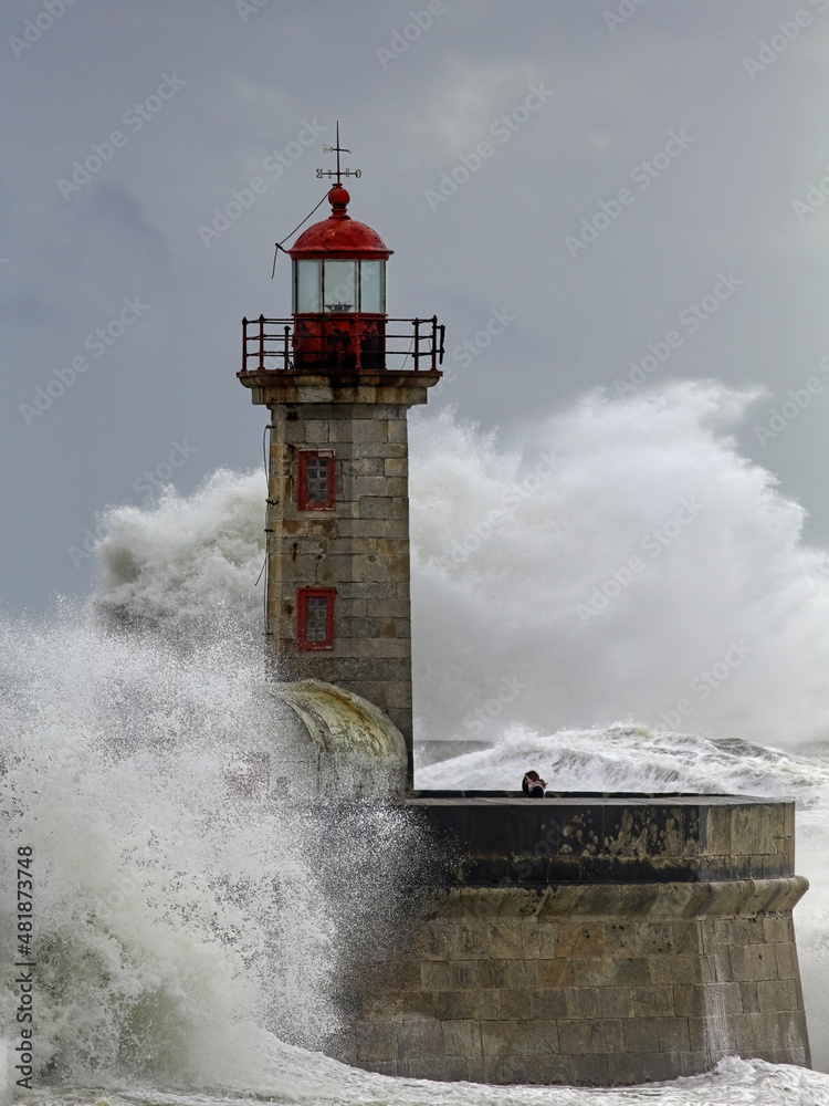 Old lighthouse under heavy storm
