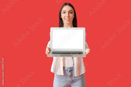 Young woman with modern lap...