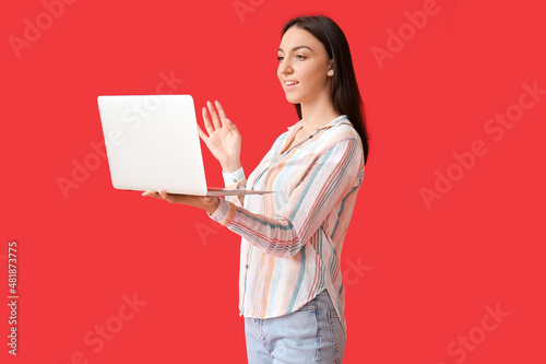 Young woman with modern lap...