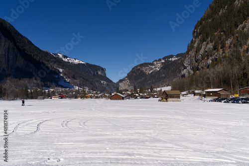 Mountain valley Lauterbrunnen in the Swiss Alps on a sunny winter day with mountain panorama in the background. Photo taken January 15th, 2022, Lauterbrunnen, Switzerland.