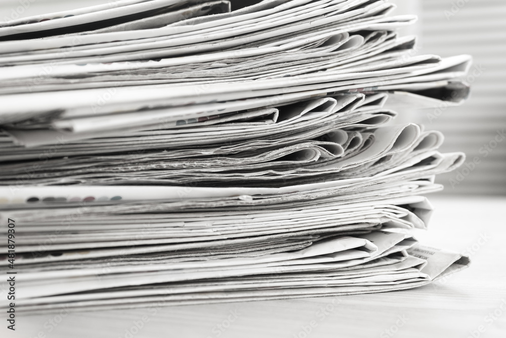 A stack of newspapers. Business news, finance. Latest information. Copy space A stack of newspapers. Business news, finance. Latest information. Copy space