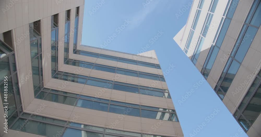 beautiful bottom view of office building against the background of the blue sky beautiful bottom view of office building against the background of the blue sky