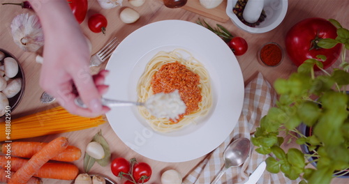 Fresh Food Ingredients On Wooden Table In Kitchen photo