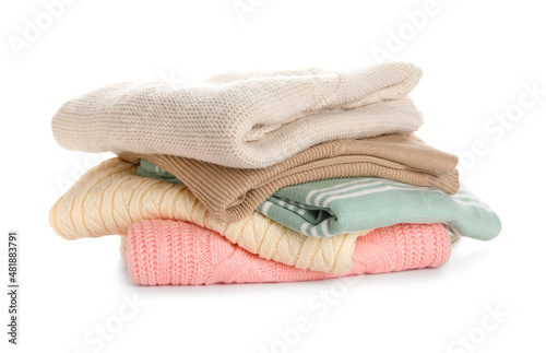 Stylish baby sweaters on white background