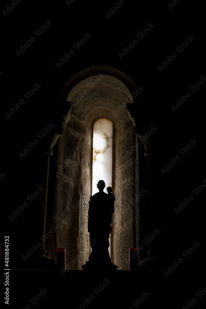 Fototapeta premium Church window with saint sculture