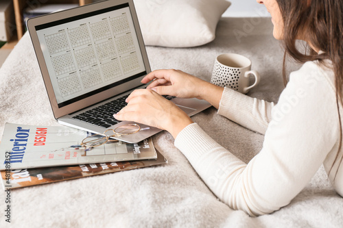 Woman using calendar on lap...