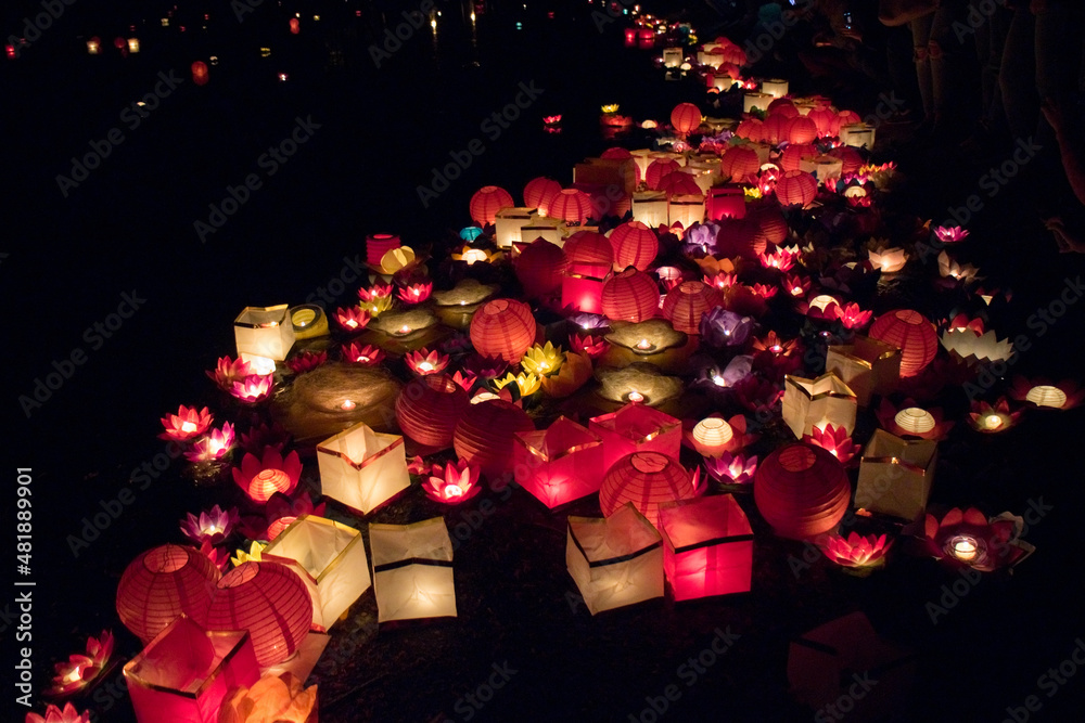 Floating paper lanterns on the water at night Stock Photo Adobe Stock