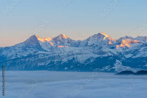 Photography Swiss mountains evening with snow and fog