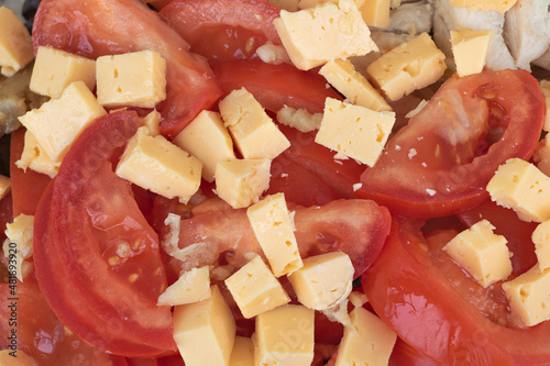 A salad that contains ingredients such as tomatoes and cheese