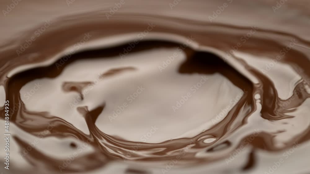 Super Slow Motion Shot of Swirling Melted Milk Chocolate at 1000 fps. Super Slow Motion Shot of Swirling Melted Milk Chocolate at 1000 fps.