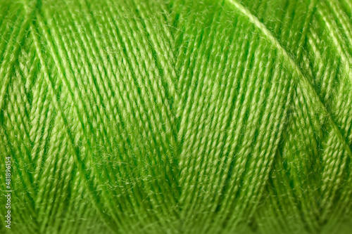 Green sewing threads as background