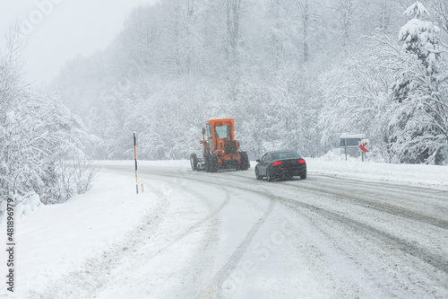 Winter wonderland landscapes. The trees are covered with snow. Cold weather. The snowplow is clearing the snow from the roads. Yedigoller National Park, (Yedigöller Milli Park). Bolu, Turkey.