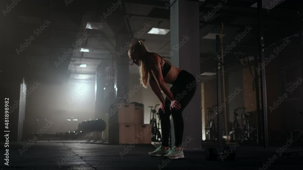 Fitness healthy woman tired after strength training exercise at gym resting, relaxing after intense workout. Refreshing And Uplifting Fitness healthy woman tired after strength training exercise at gym resting, relaxing after intense workout. Refreshing And Uplifting