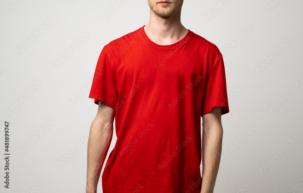 Red casual blank t shirt on man front view isolated on white background. Fashion design template. Red casual blank t shirt on man front view isolated on white background. Fashion design template.