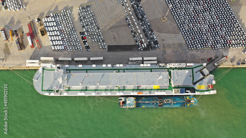 Aerial drone photo of international car and Ro Ro boat terminal in Keratsini area at sunset, Piraeus, Attica, Greece photo