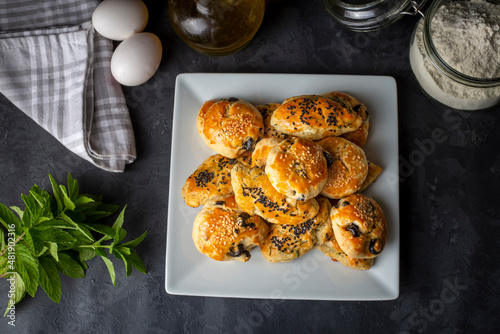 Turkish style pastry with olives and dill cheese pastry (Turkish name; Zeytinli pogaca ve dere otlu peynirli pogaca) photo