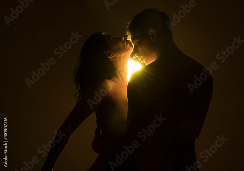 silhouette of a couple kissing. Model. Erotica. Couple in love. Fashion. People. Model. 