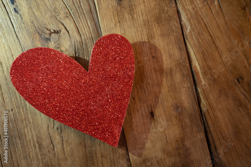 Red Heart Made from Glitter on a Wooden Surfaced Table