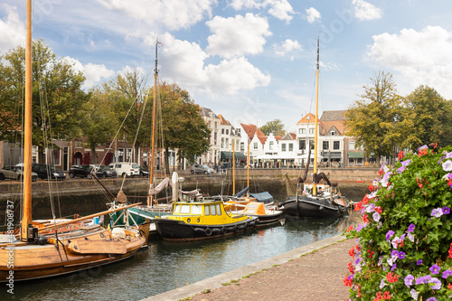 Old sailing ships in the harbor of the picturesque town of Zierikzee in the province of Zeeland, Netherlands. photo
