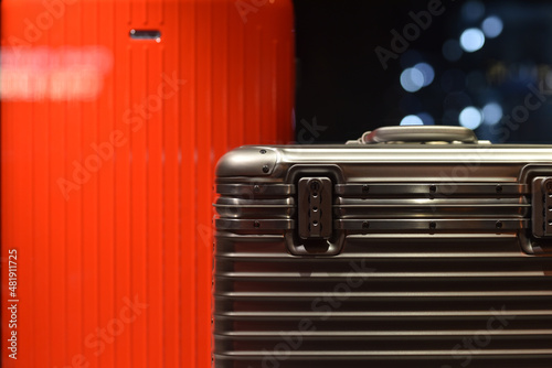 expensive shockproof metal suitcase for equipment in close-up in the dark photo