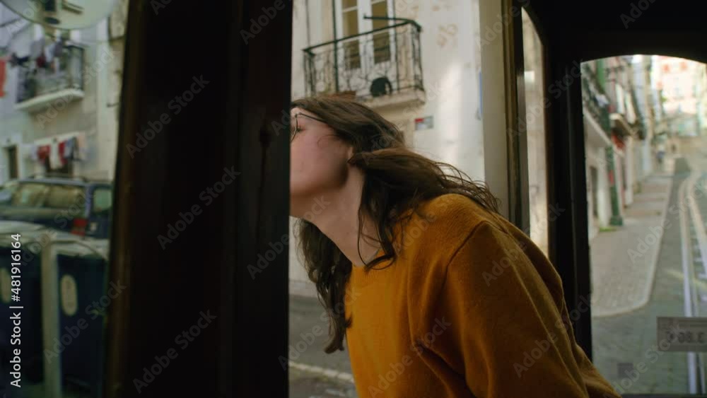 Young woman explore Lisbon from retro old tram. High quality 4k footage Young woman explore Lisbon from retro old tram. High quality 4k footage
