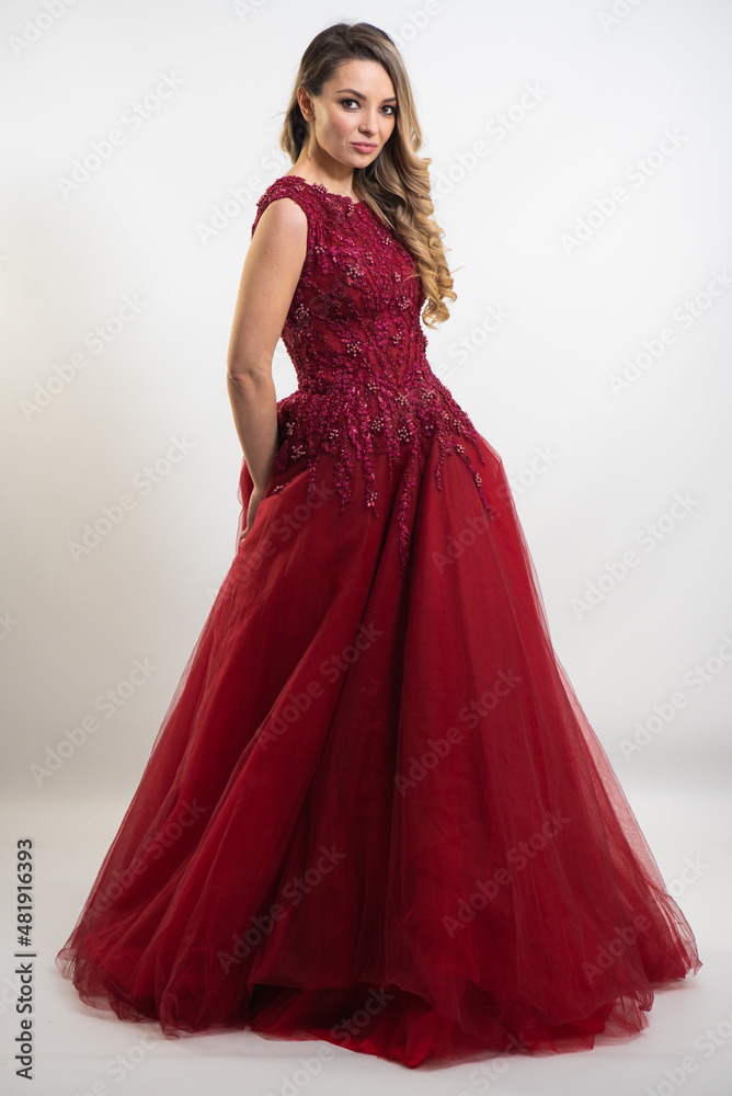 beautiful young blond woman in dress on white studio background beautiful young blond woman in dress on white studio background